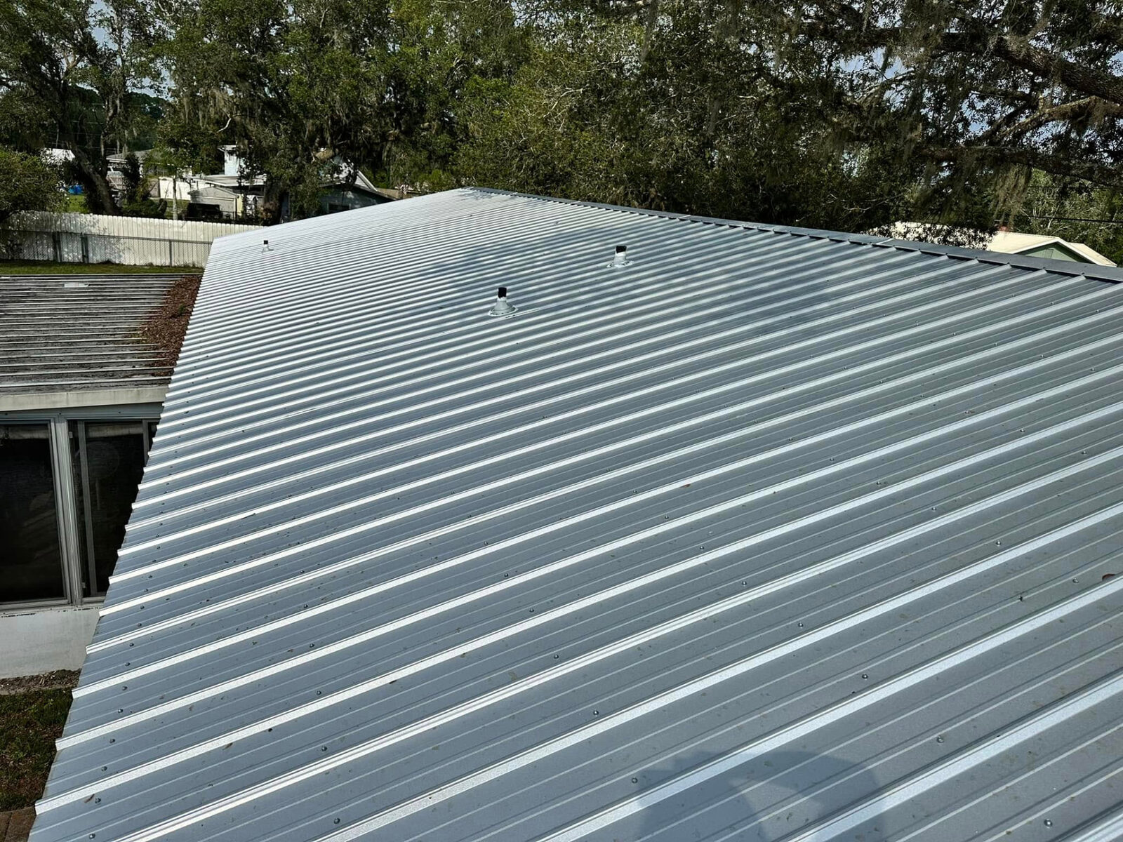 New galvanized metal panel roof on a single-story Florida home