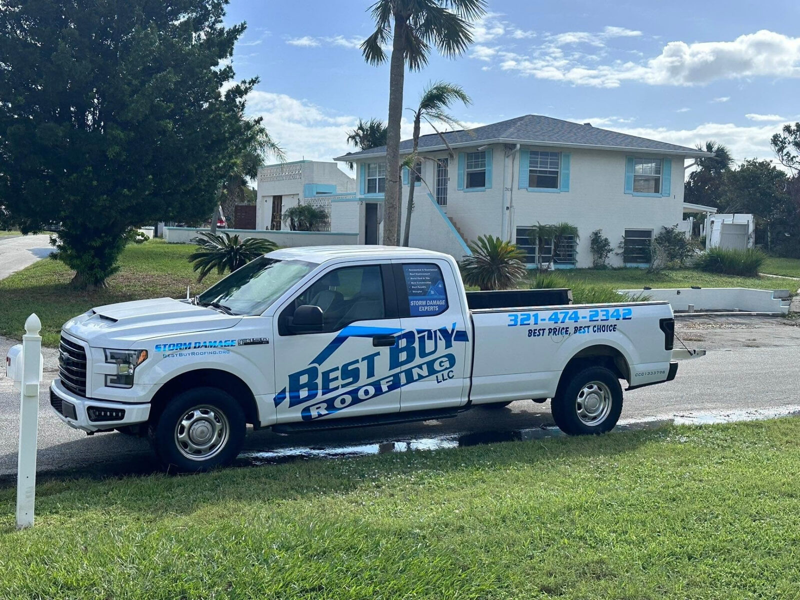 Best Buy Roofing LLC work truck parked outside a Florida home